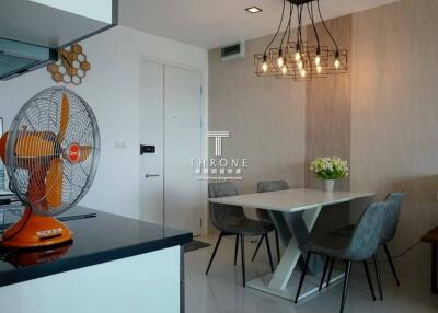 Modern dining area with stylish lighting and contemporary furniture