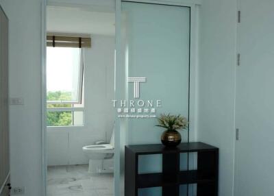 A bright bathroom with a window view and modern fixtures