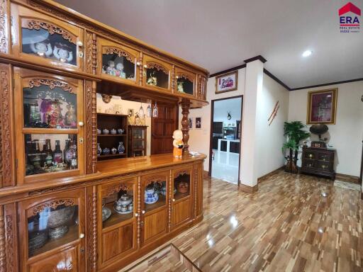 Living room with wooden cabinets and parquet flooring