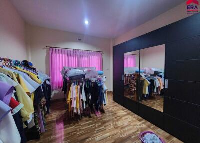 Bedroom with wardrobe and clothes