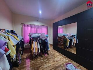 Bedroom with wardrobe and clothes