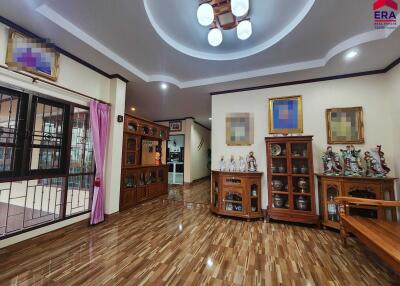 Spacious living room with wooden furniture and decor