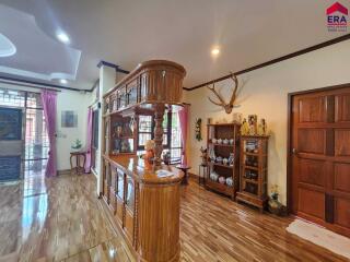 Cozy living room with wooden furniture and decorative items