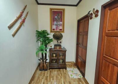 Decorated hallway with flooring and decorative items