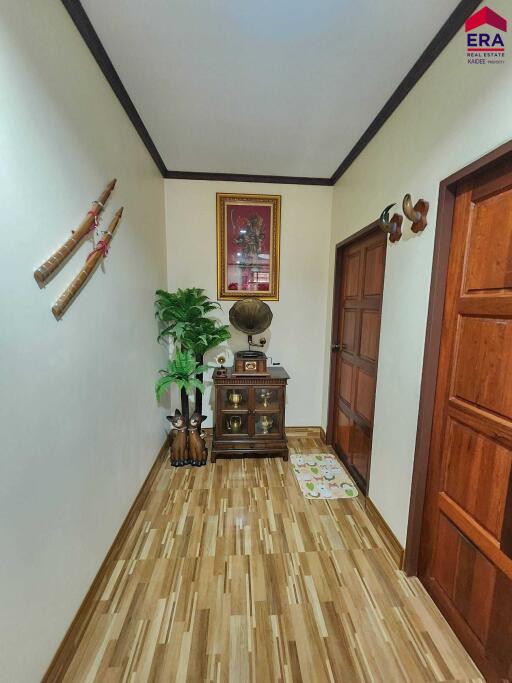 Decorated hallway with flooring and decorative items