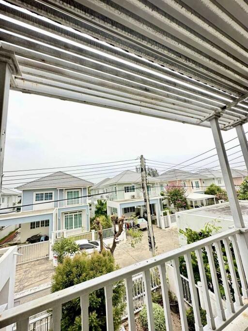 View from the balcony showing a residential neighborhood