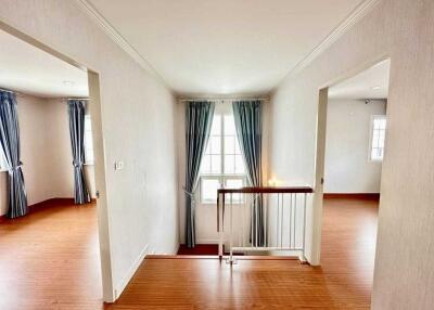 Bright hallway with wooden flooring