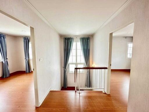 Bright hallway with wooden flooring