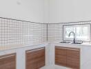 Modern kitchen with tiled backsplash and wooden cabinets