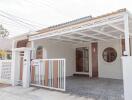 Front view of a modern single-story house with a carport