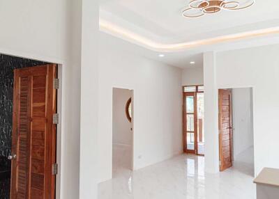 Spacious and modern interior with wooden doors and bright lighting