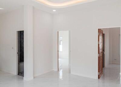 Minimalist white interior with multiple doorways