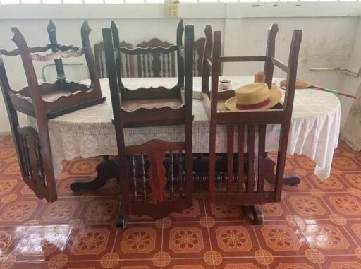 Dining room with table and stacked chairs