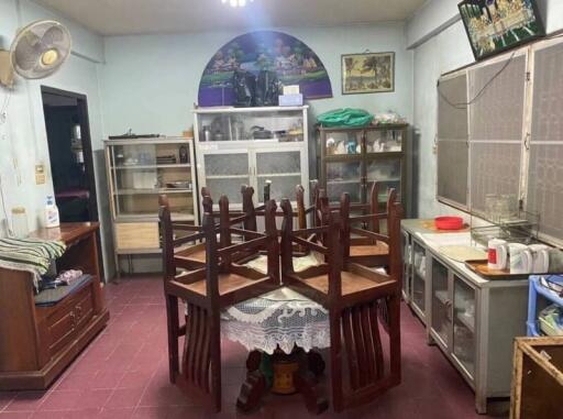 A kitchen with dining table and chairs