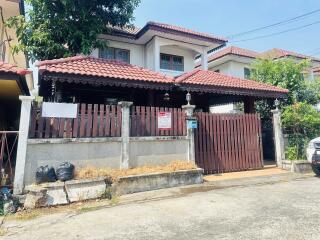 Two-story house with gated front yard