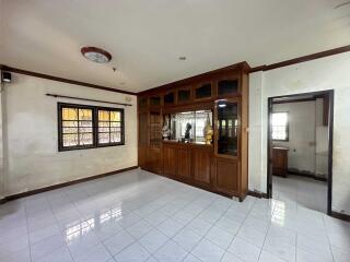 Main living area with wooden cabinetry and tiled floor