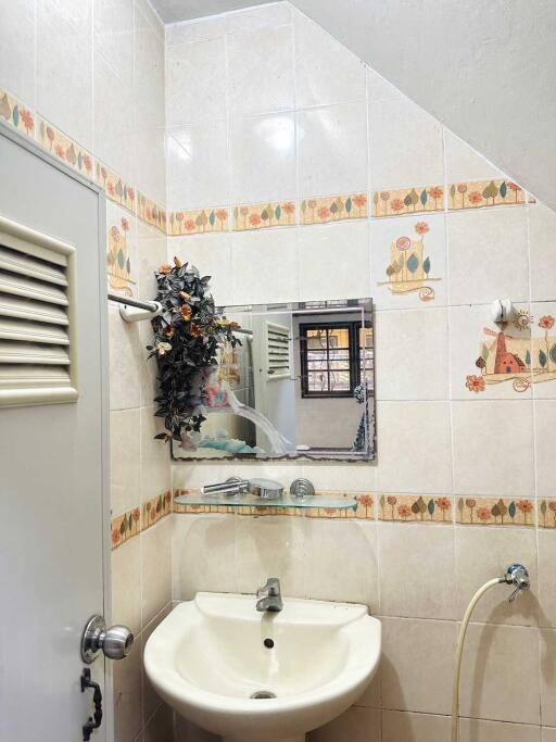 Small bathroom with sink and mirror