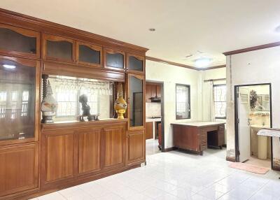 Spacious and well-lit living area with wooden cabinets