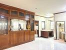 Spacious and well-lit living area with wooden cabinets