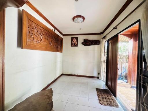 Bright and cozy living area with wooden decorations