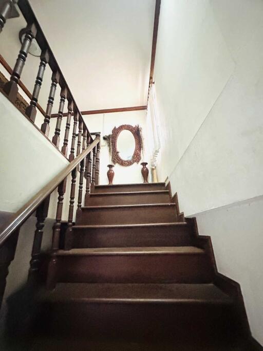 Wooden staircase with decorative elements.