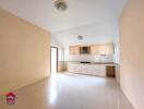 Spacious kitchen with built-in cabinets and large windows