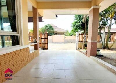 Covered outdoor space with tiled flooring