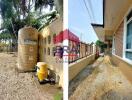 Exterior view of property with water storage tank and gravel walkway