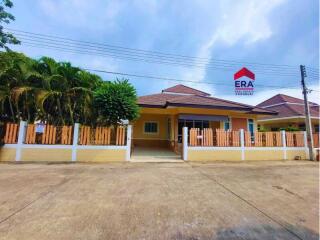 Front view of a house with a fenced yard