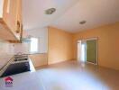 Spacious kitchen area with built-in cabinets and modern fixtures