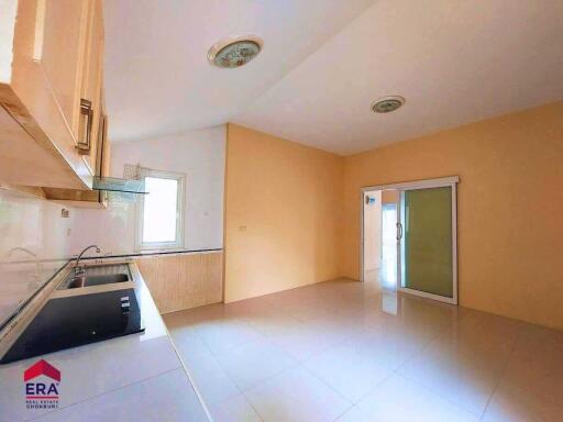 Spacious kitchen area with built-in cabinets and modern fixtures