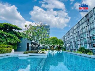 Outdoor pool area with surrounding modern apartment buildings