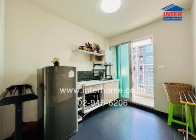 Bright kitchen with modern appliances and access to balcony