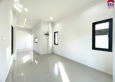 Empty room with white walls and windows