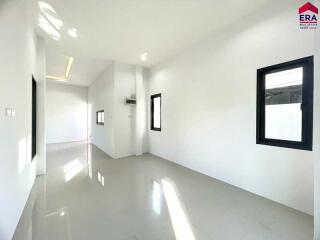 Empty room with white walls and windows