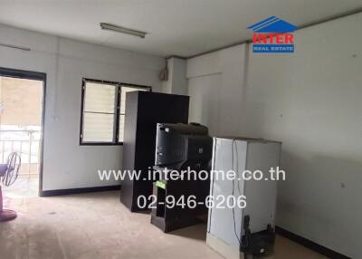 Unfurnished room with appliances and a window