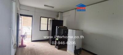 Unfurnished room with appliances and a window