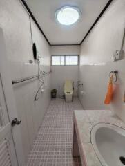 Bathroom with shower, toilet, and sink