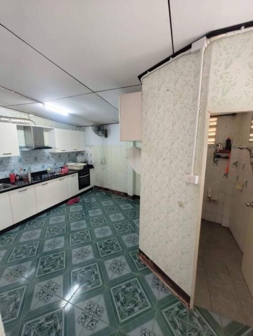 Spacious kitchen with modern appliances and tiled flooring