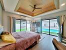 Modern bedroom with pool view and wooden ceiling