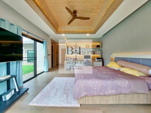 Modern bedroom with elegant decor and ceiling fan