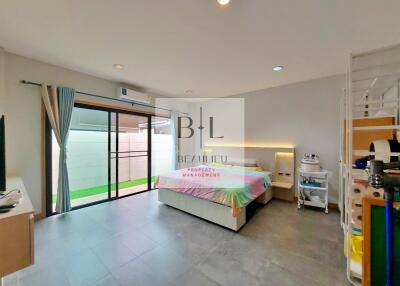 Spacious bedroom with sliding glass doors