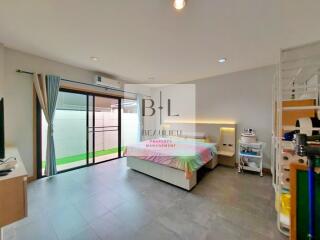 Spacious bedroom with sliding glass doors