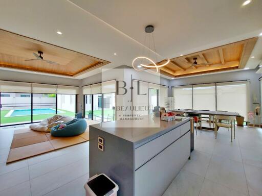 Spacious open-concept living area with modern furnishings and ample natural light