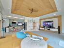 Modern living room with open kitchen and wooden ceiling