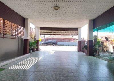 Spacious carport with tiled flooring