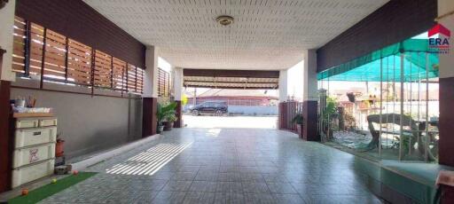 Spacious carport with tiled flooring