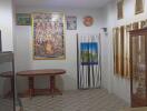 Living room with decorative wall art and glass cabinet