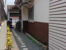 Pathway Alongside House with Plants