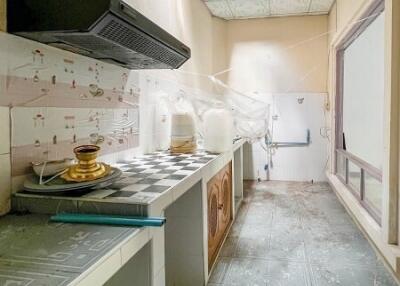 Bright kitchen with tiled countertops and backsplash